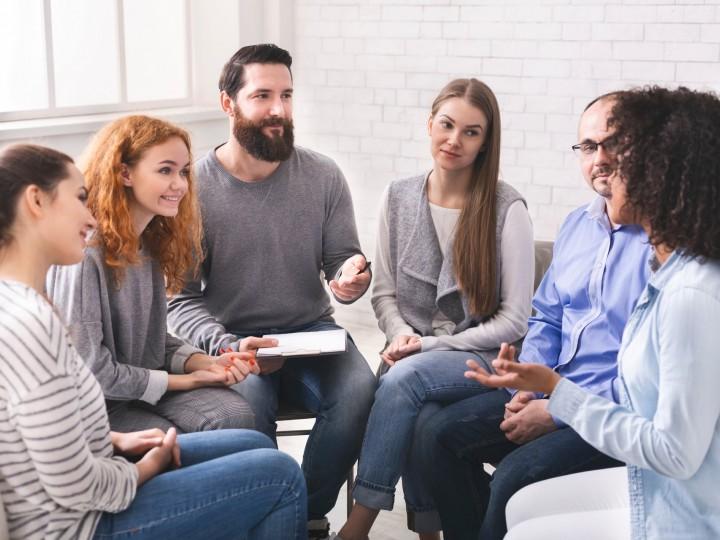 A group of students gather in a circle for discussion